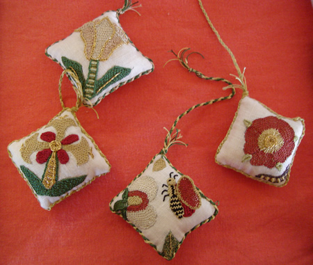 Grouping of Four Pincushions